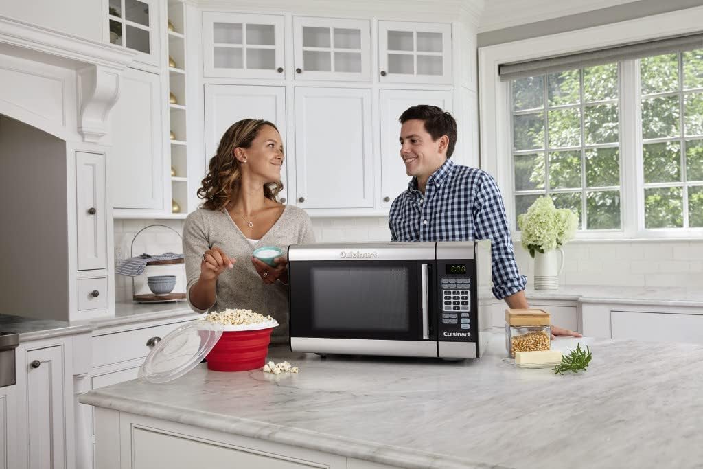A microwave and two people.