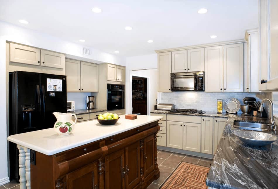 white kitchen black appliances