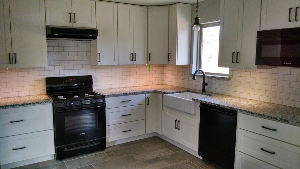 white kitchen black appliances