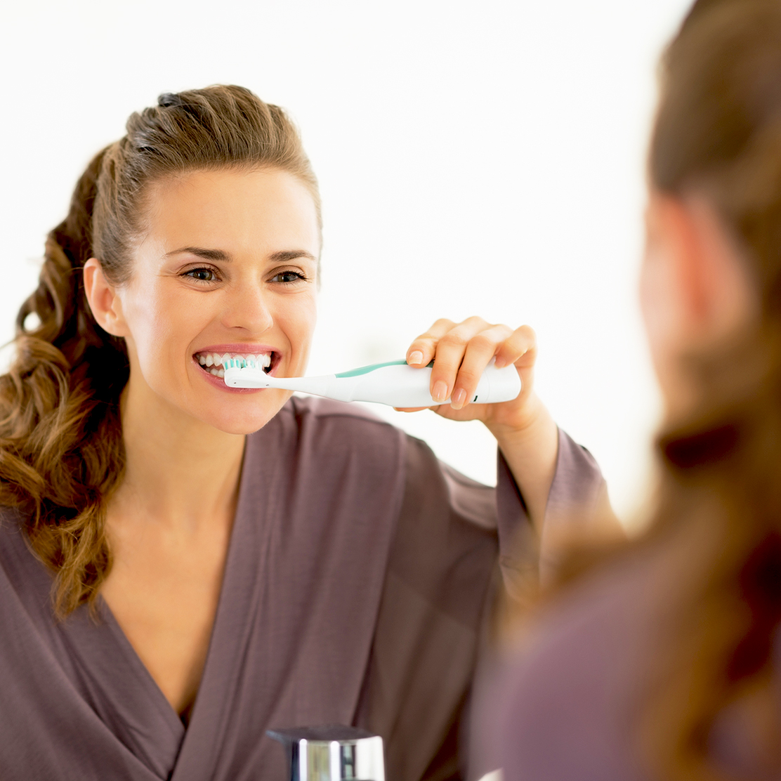 brush a temporary crown with an electric toothbrush