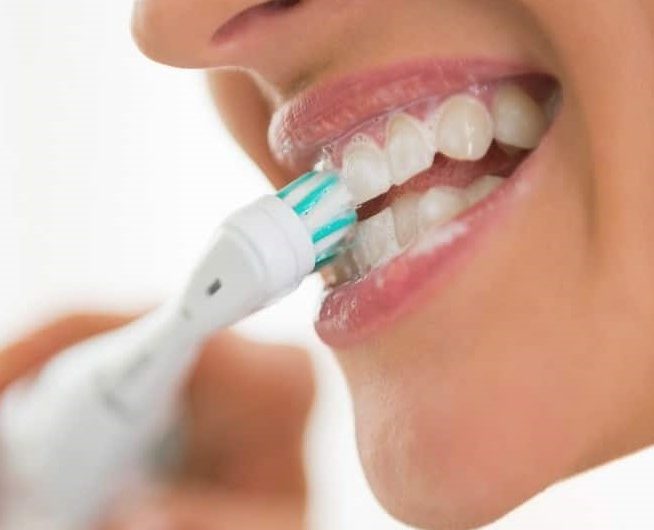 Brushing Teeth with Electric Toothbrush: A Comprehensive Guide